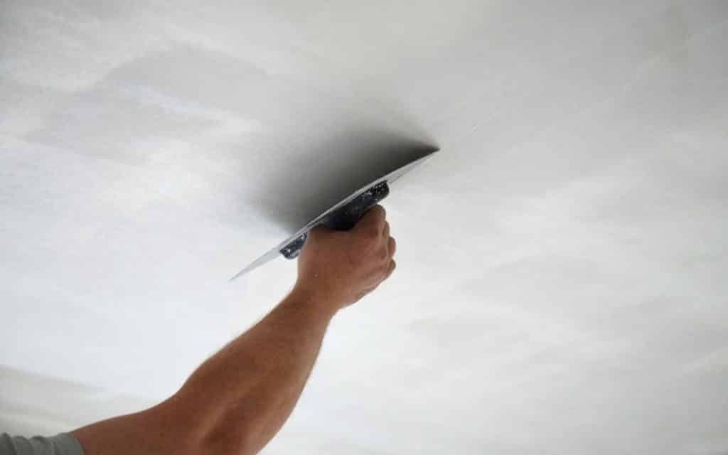 Man painting a ceilings from Millington Decor, Essex Painters